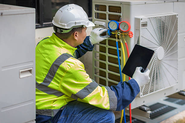 Professional Air Conditioning Repair technician working in Vaughn, WA